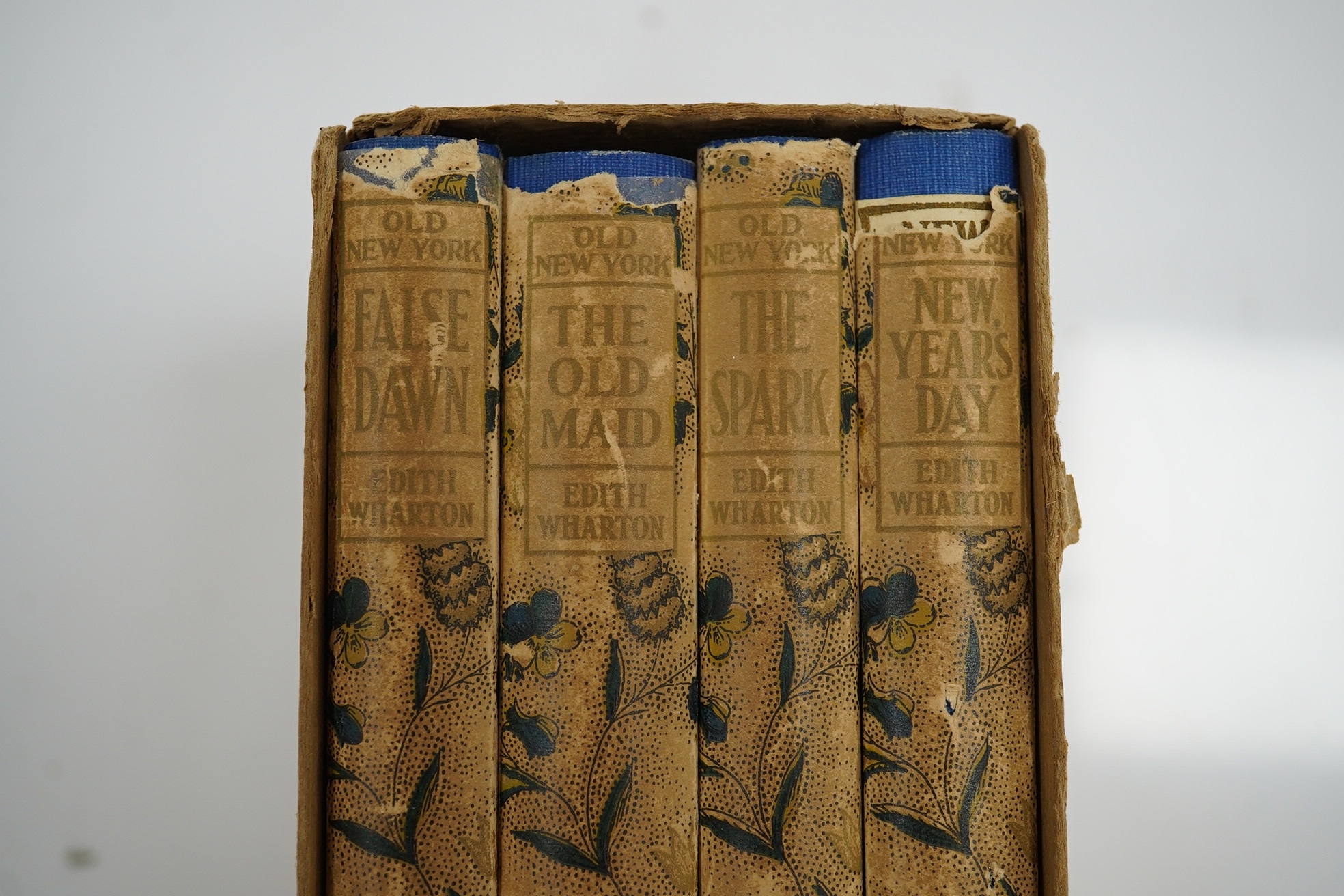Wharton, Edith - Old New York ... Decorations by E.C. Caswell. First Edition, 4 vols. pictorial e/ps. to each volume; original roy. blue cloth with pictorial label on upper boards and printed label on spines, coloured an
